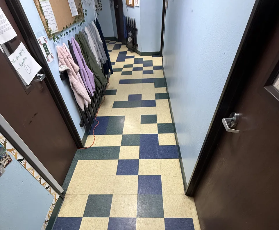 Before: checkered VCT tile in the hallway