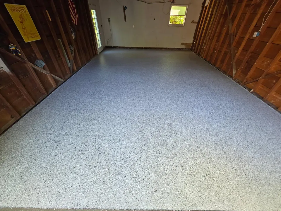 After: full-broadcast flake floor in the same Land Park garage
