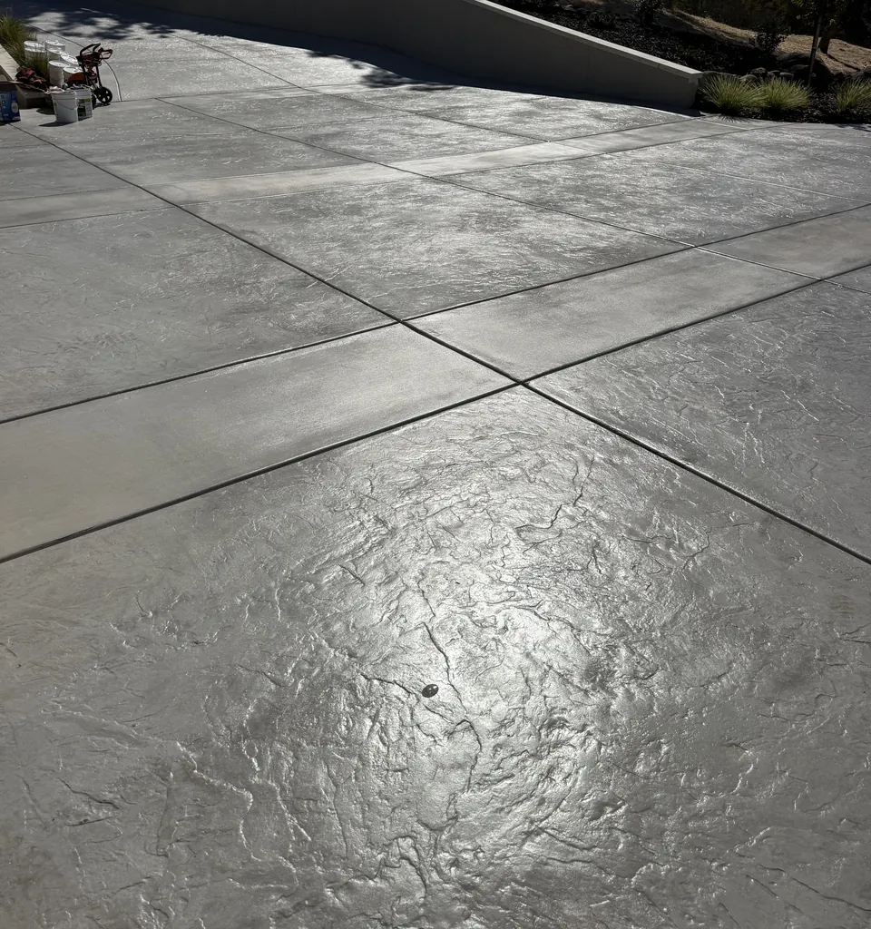 After: sealed stamped concrete driveway